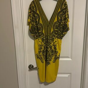 ICO Dress Yellow & Black. Used. Polyester and Lycra. Size Large